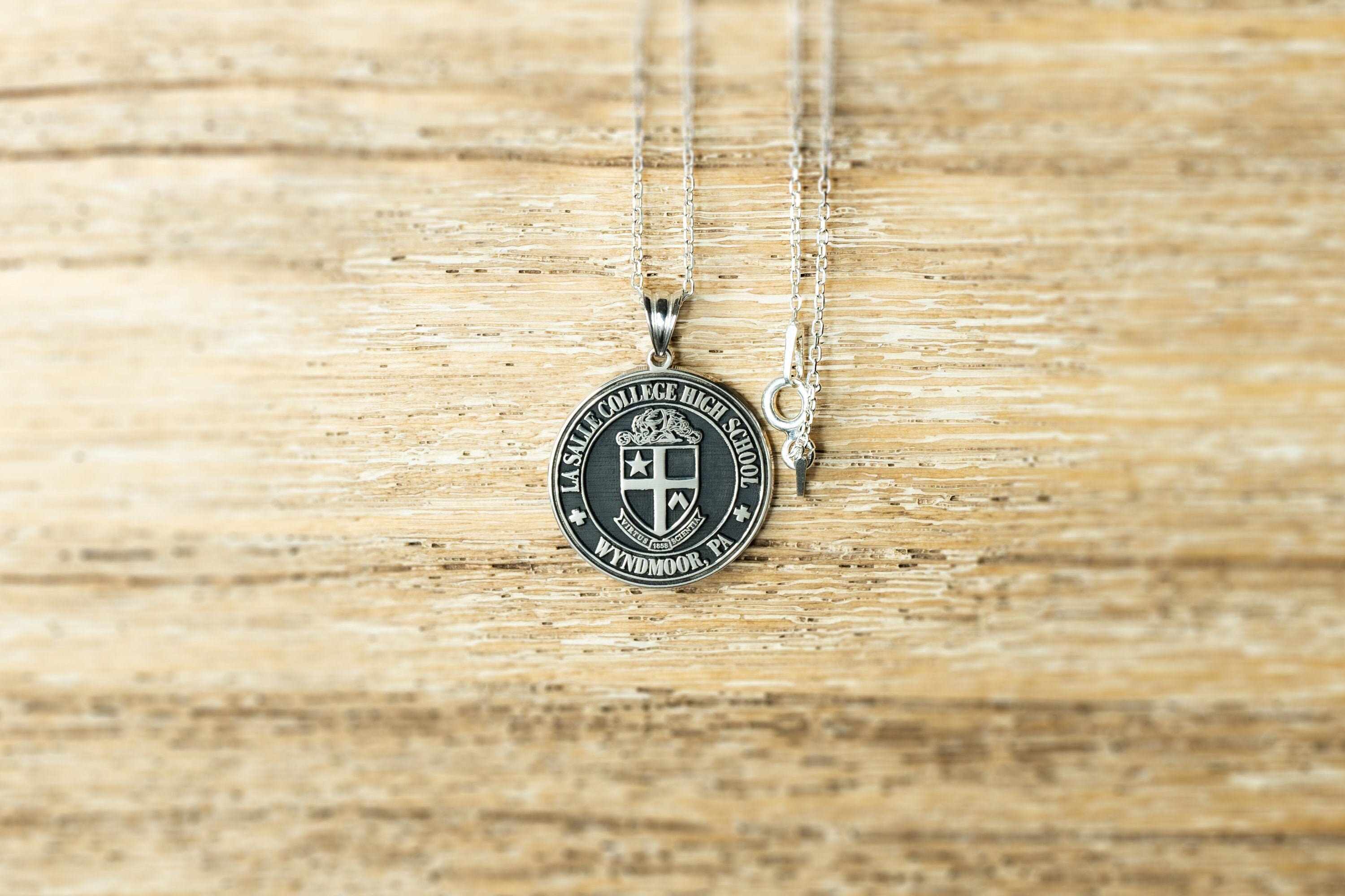 10. Personalized Sterling Silver Necklace Engraved with College or High School Logo